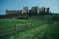 808057 Bamburgh Castle, Viewed Across Fields, Northumberland, U.K. A4 Photo Print
