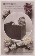 baby wrapped up as a present in a box old rpc 135471 A4 Photo Print
