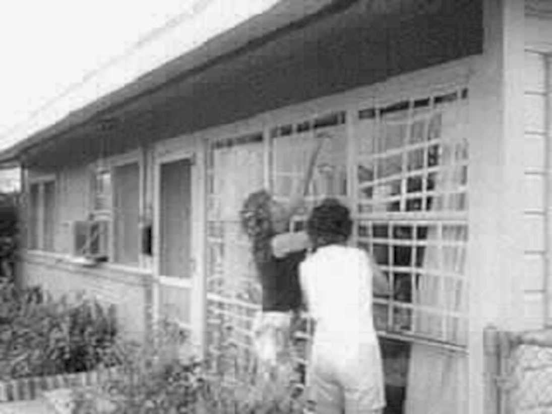 black figures building1980s 1990s A4 Photo Print
